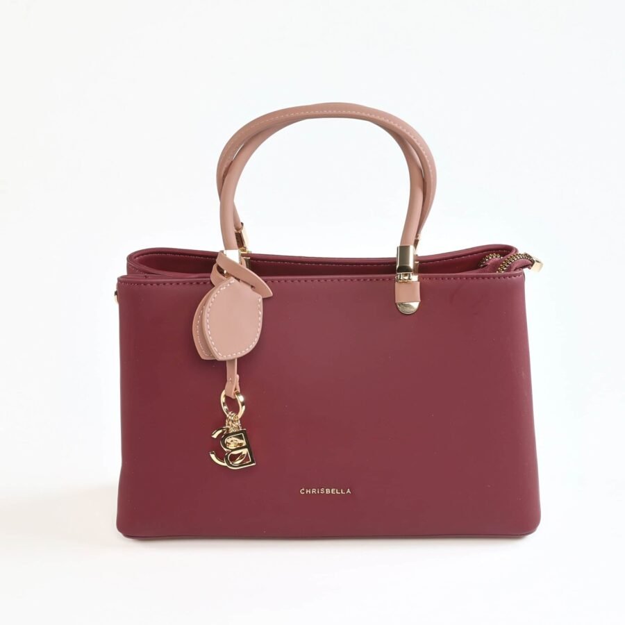 Sac à main en cuir rose et bordeaux, élégant et tendance..