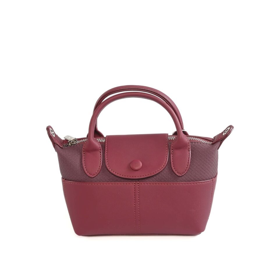 Sac à main en cuir rose, parfait pour un style chic et pratique..