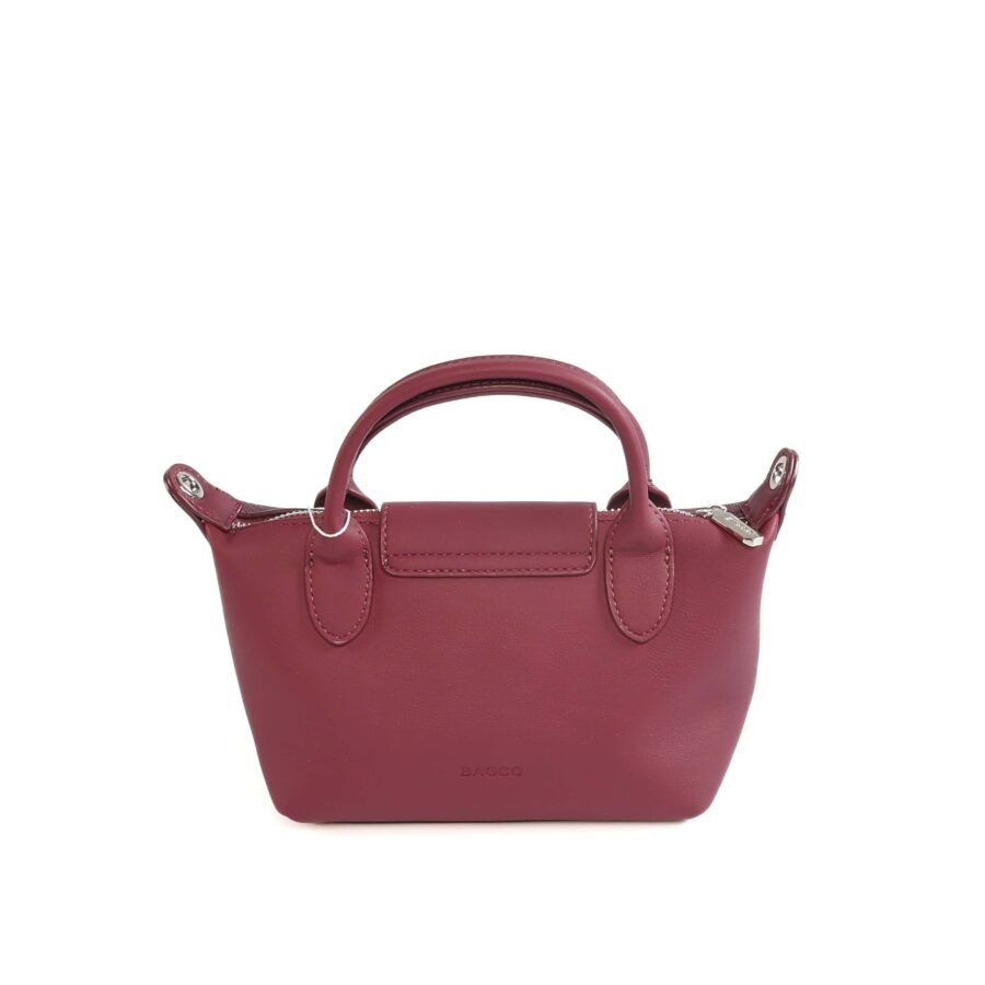 Sac à main en cuir rose foncé, idéal pour femmes, avec poignée robuste et fermeture zippée..